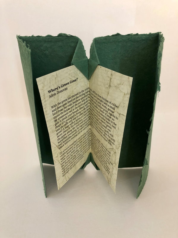 Folded book from Art of The Fold containing poem Where's Green Gone by Adele Donovan